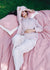 woman asleep on linen bedding