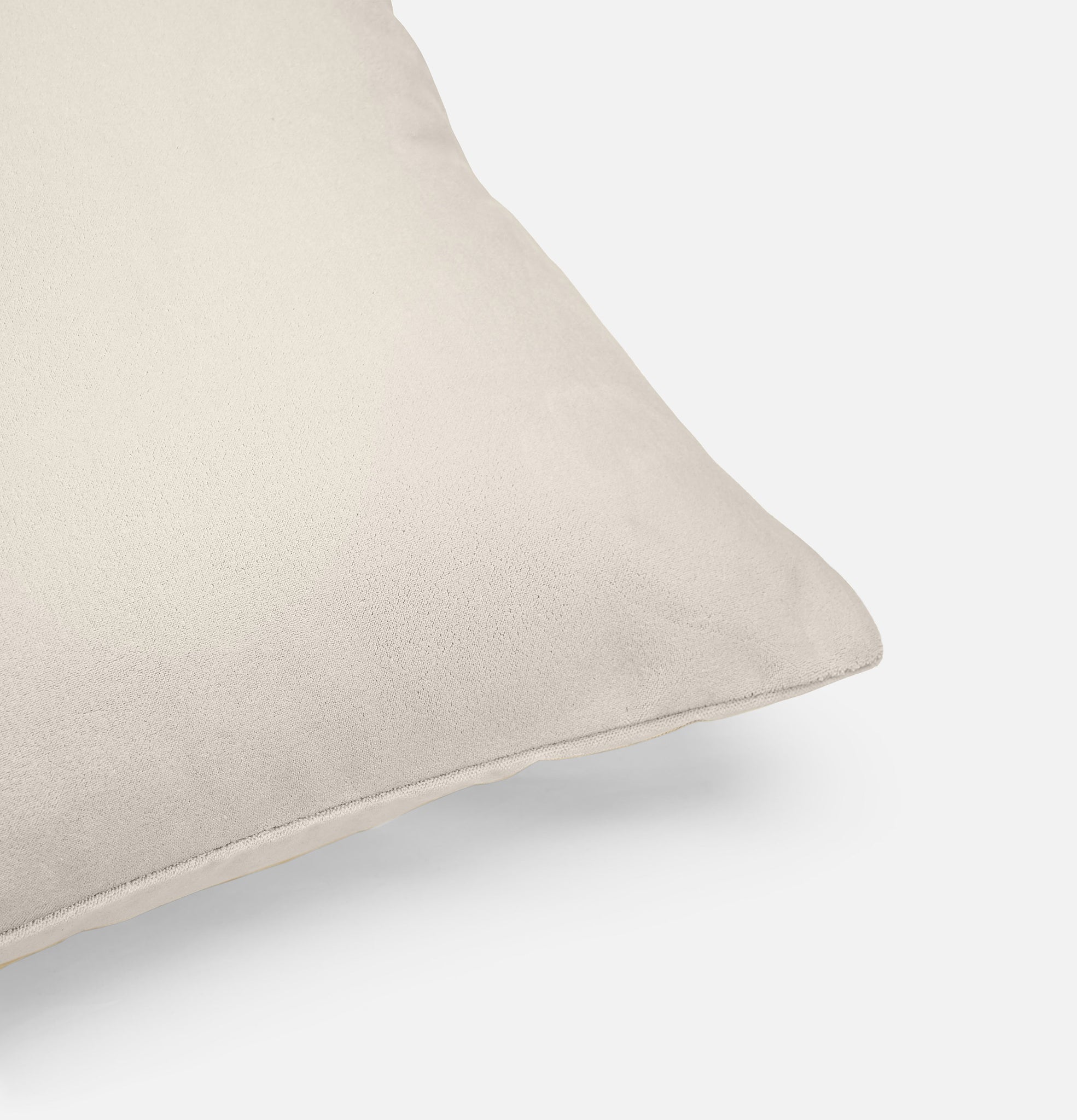Corner detail of cloudy white velvet cushion