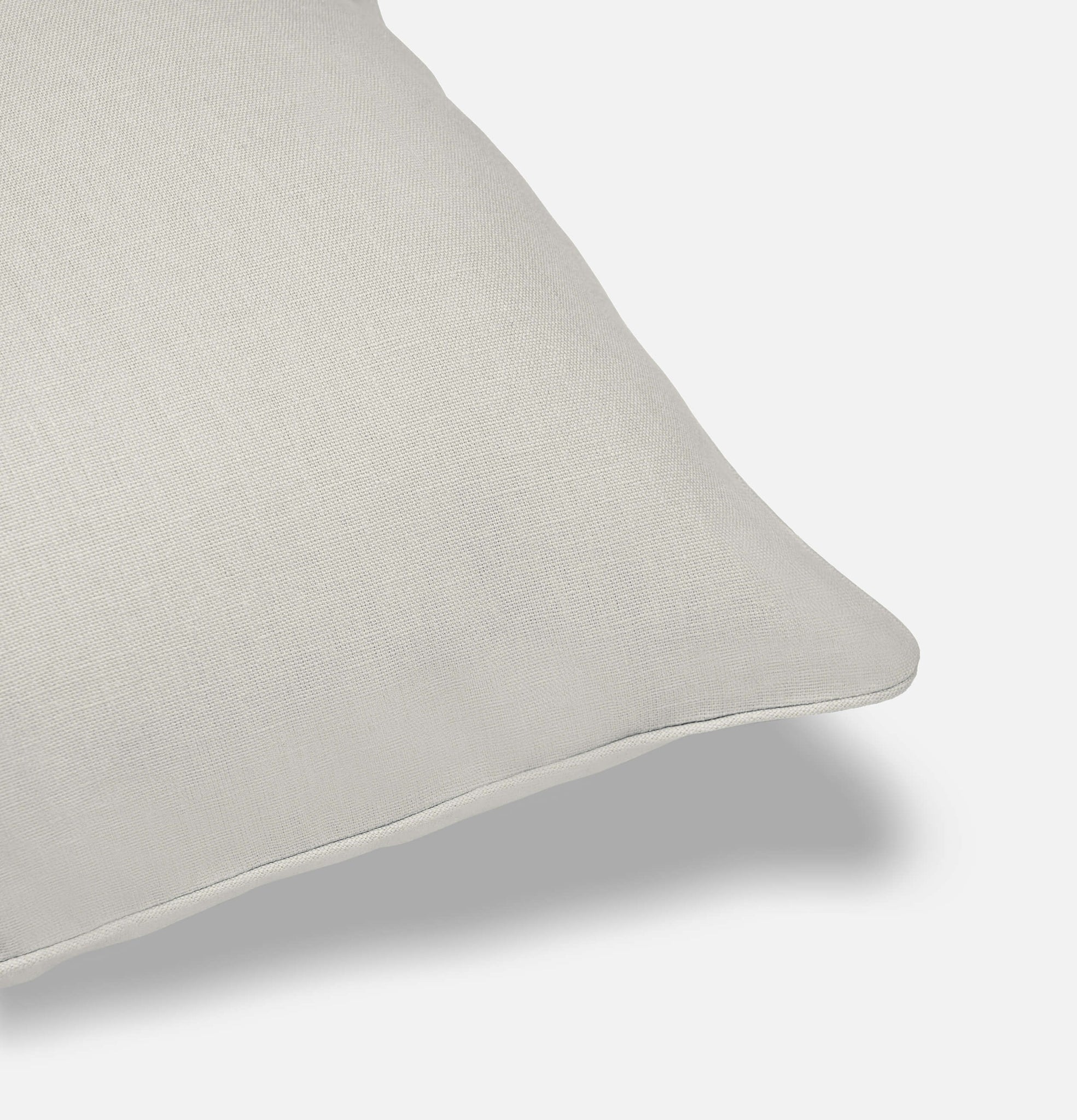 Corner detail of frost grey linen cushion