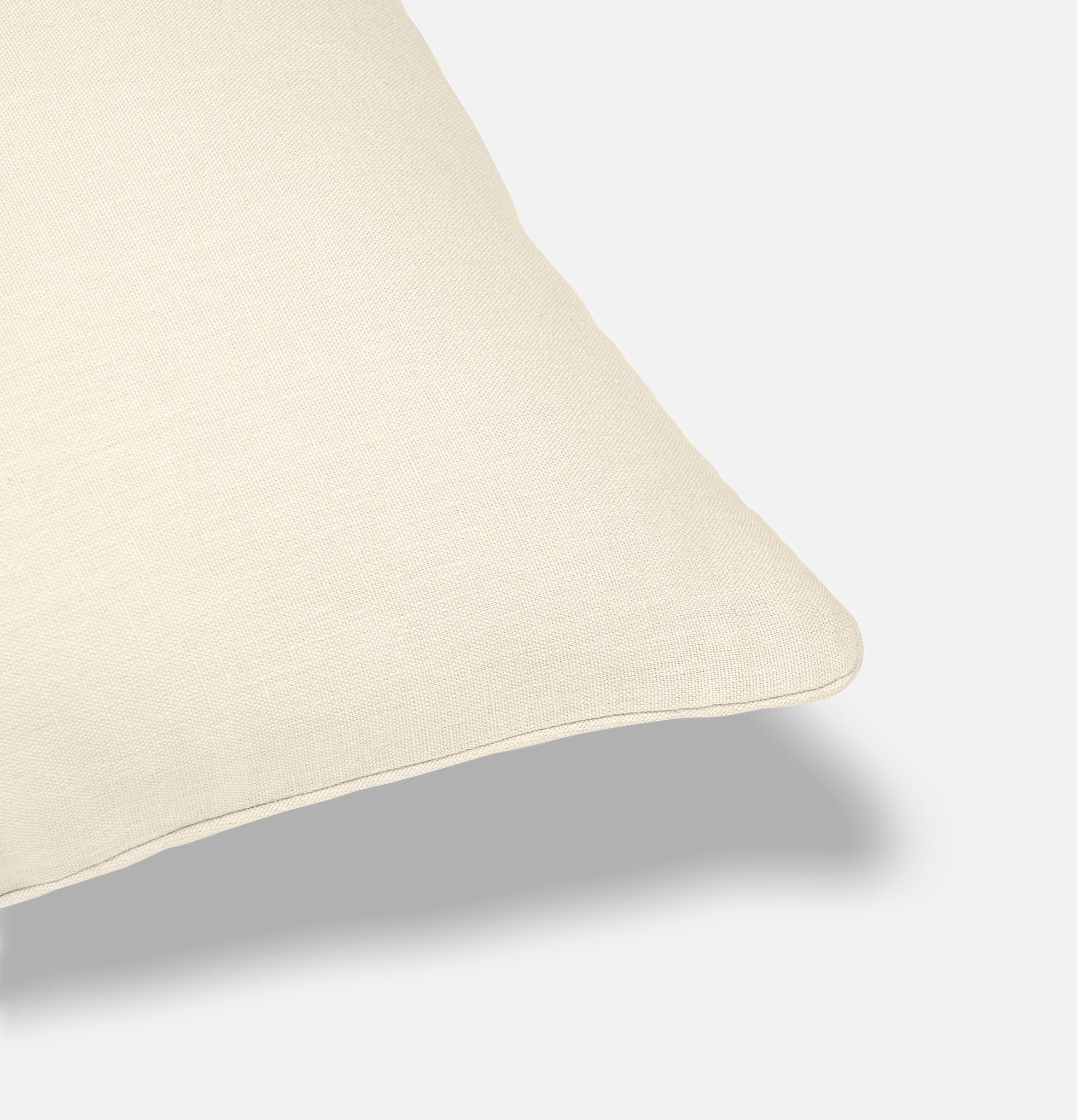 Corner detail of iridescent ivory linen cushion