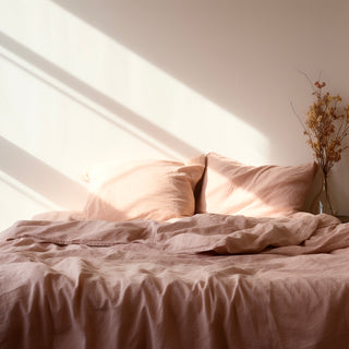 midsummer pink bedding on bed, in sunny bedroom