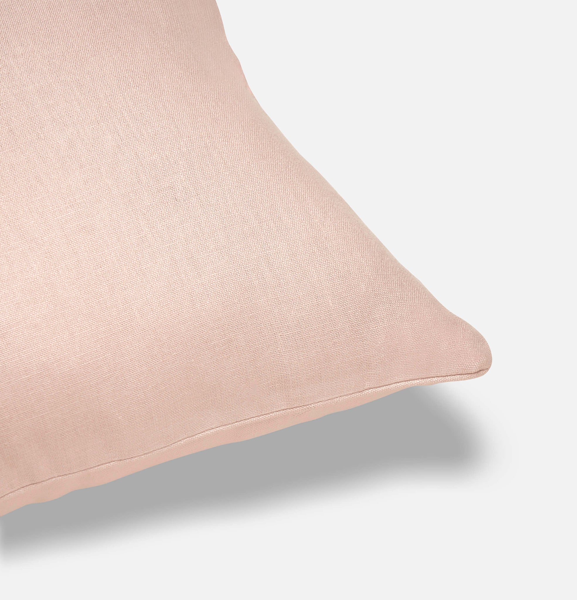 Corner detail of Midsummer pink linen cushion