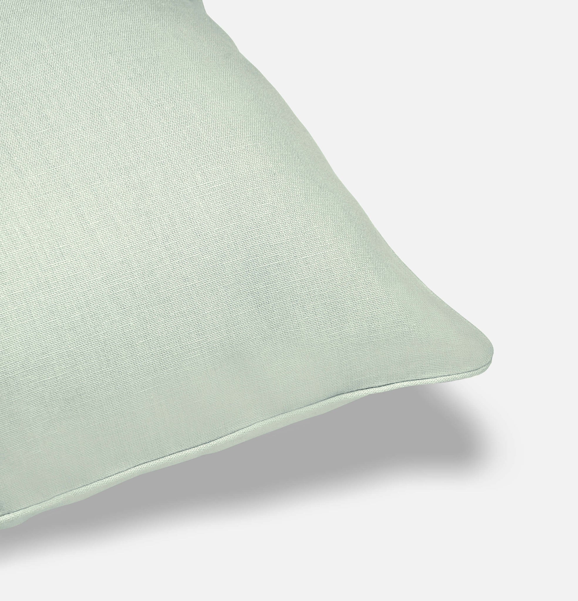 Corner detail of spring blue linen cushion