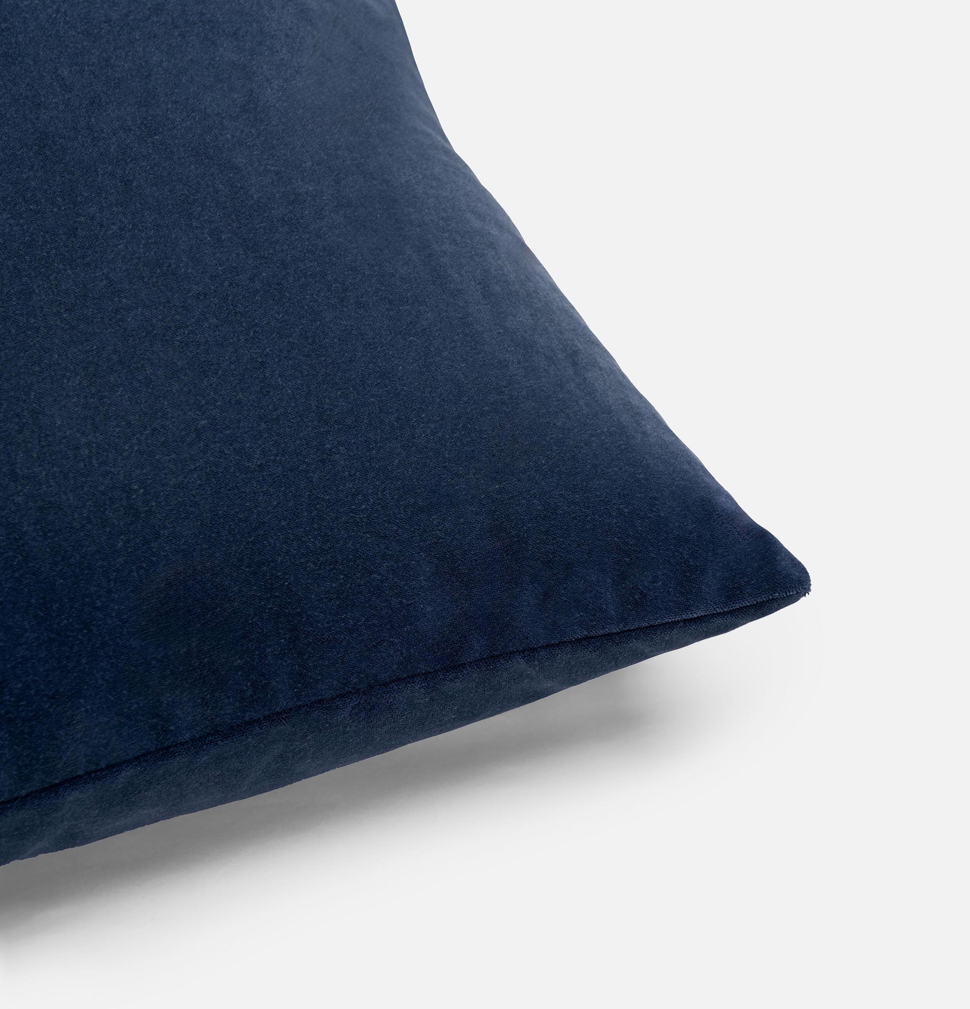 Corner detail of navy velvet cushion